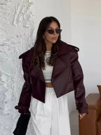 Alt text: Women's oversized burgundy jacket featuring wide lapels and crafted from soft, lightweight fabric for a relaxed…