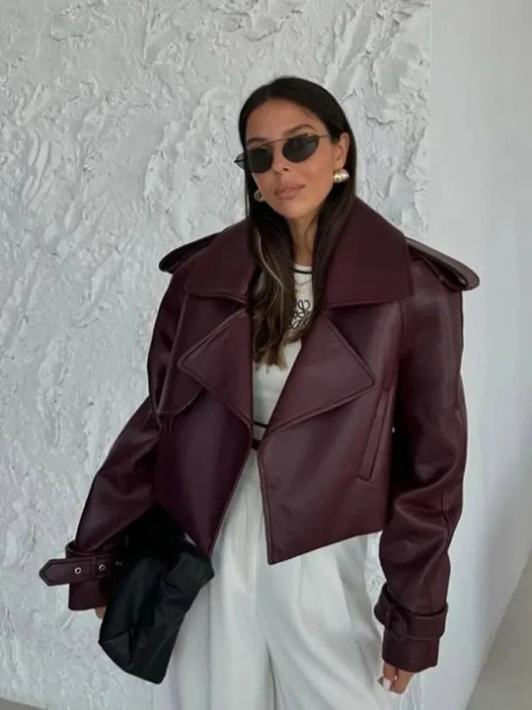 Women's oversized burgundy jacket featuring wide lapels, made from soft fabric for a comfortable, relaxed fit.
