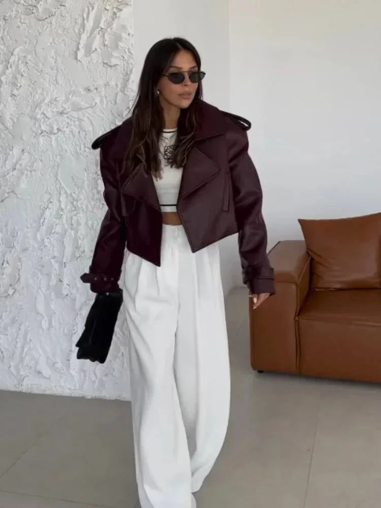 Women's oversized burgundy jacket featuring wide lapels and soft fabric, perfect for layering in cool weather.