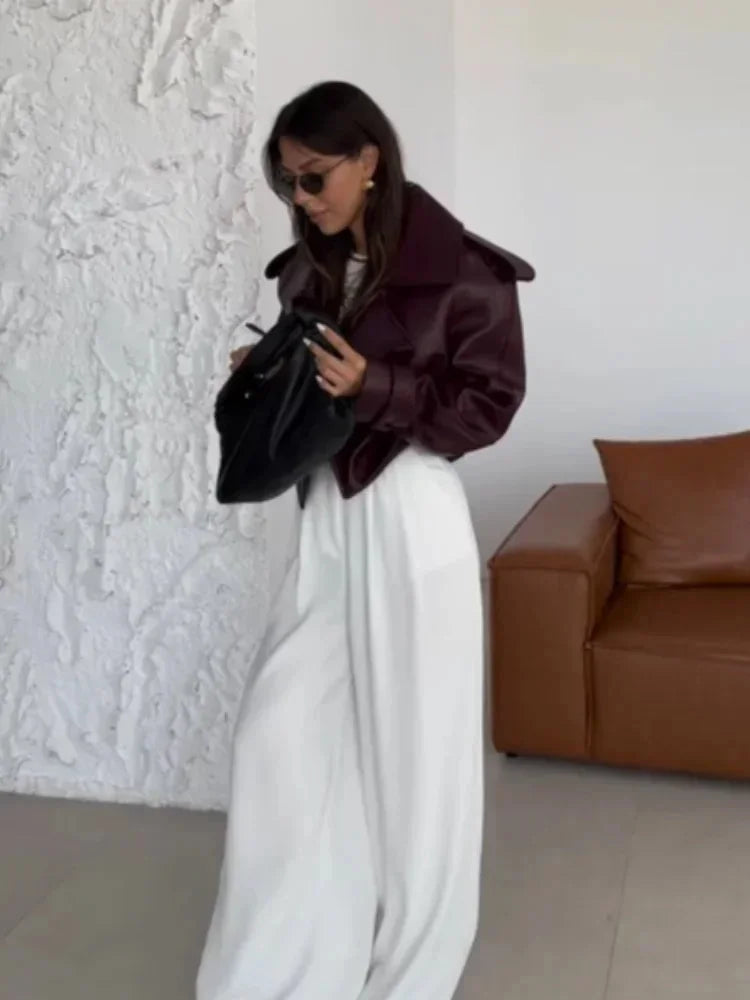 Women's oversized burgundy jacket featuring wide lapels, crafted from soft fabric for a comfortable, relaxed fit.