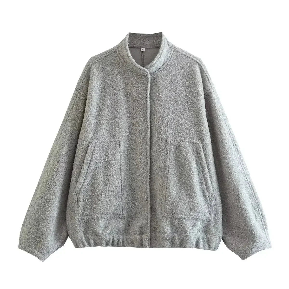 Women's oversized casual bomber jacket with button-front, made from soft cotton blend and featuring ribbed cuffs and hem.