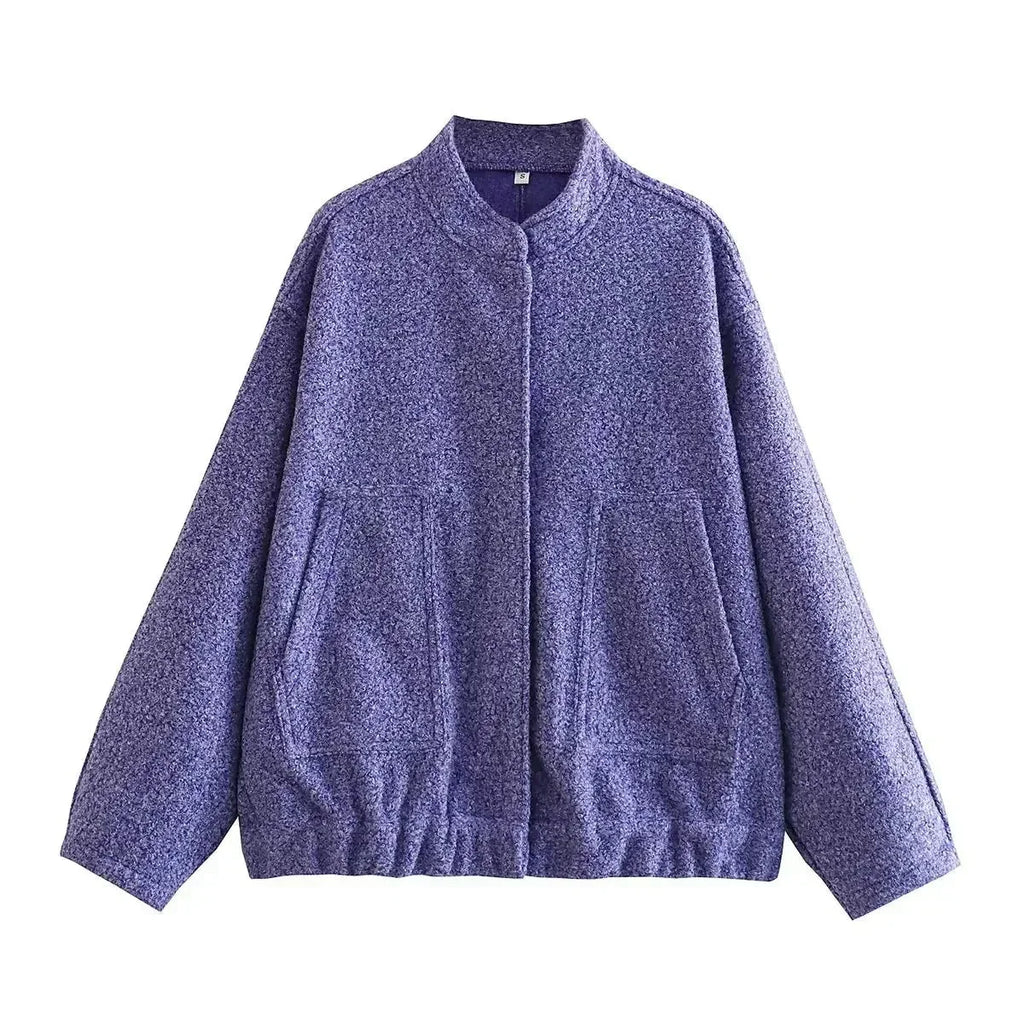 Women’s oversized bomber jacket with button-front, made from lightweight fabric, featuring a relaxed fit and side pockets.