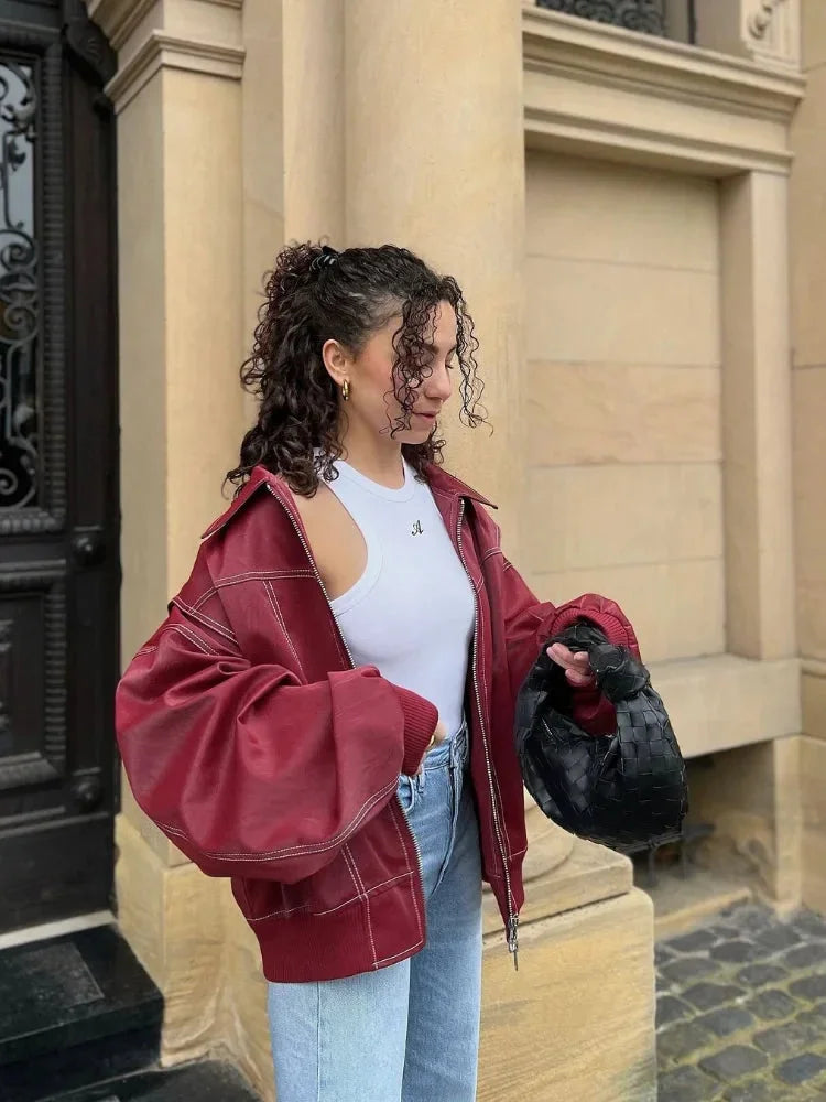 Women's oversized casual jacket with zipper, made from soft cotton blend, featuring a relaxed fit and two front pockets.