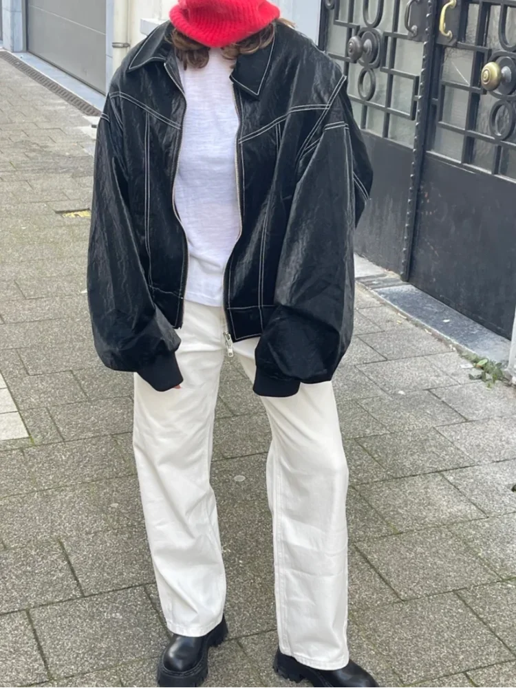 Women's oversized casual jacket with zipper, crafted from soft cotton blend, featuring a relaxed fit and practical pockets.
