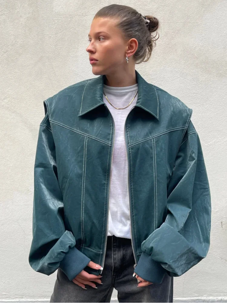 Women's oversized casual jacket with zipper, made from soft cotton blend fabric, featuring a relaxed fit and roomy pockets.