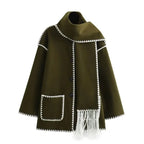 Women's oversized coat in soft wool blend, featuring an integrated scarf and stylish fringe detailing for added flair.