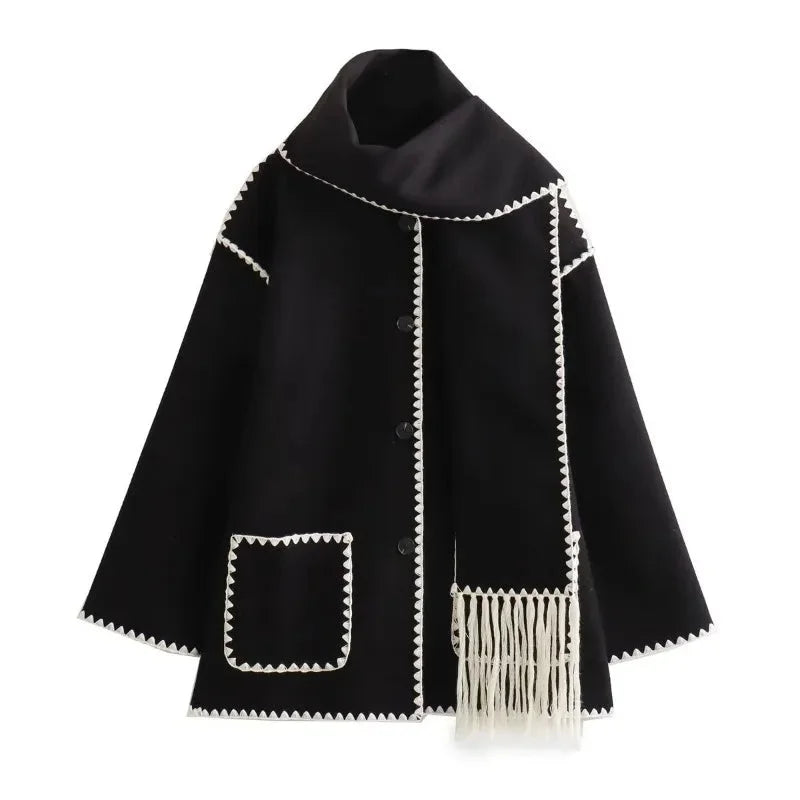 Women’s oversized coat in soft fabric, featuring an integrated scarf and stylish fringe, perfect for layering in cool…
