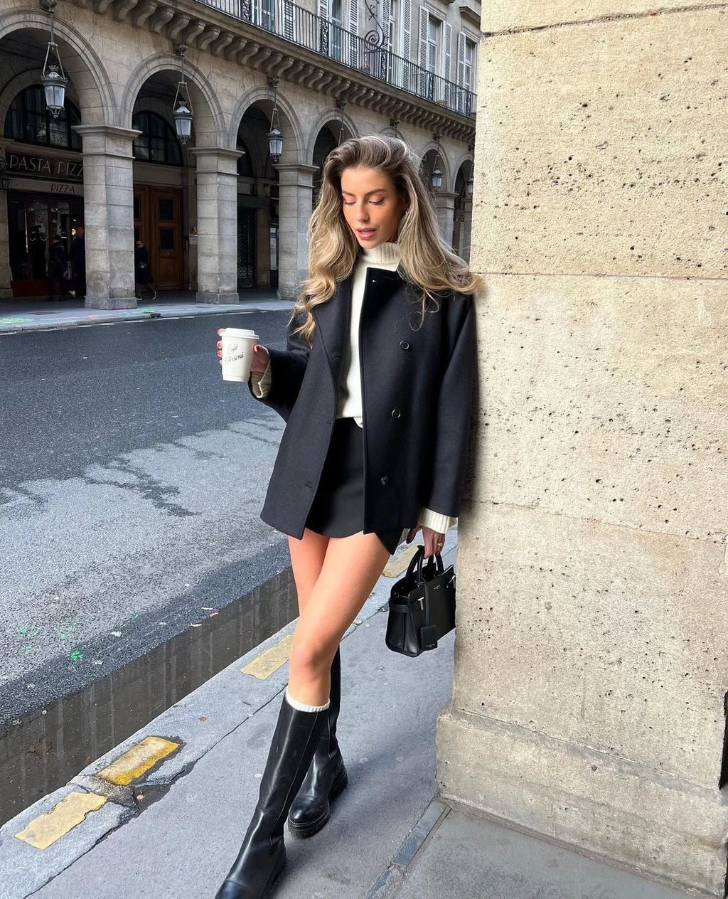Women's oversized coat featuring wide lapels, button closure, and made from soft, warm fabric for comfort in cool weather.