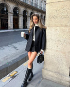 Women's oversized coat featuring wide lapels, button closure, and made from soft, warm fabric for comfort in cool weather.