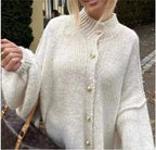 Women's oversized cozy pullover sweater, made of soft fabric, featuring long sleeves and a relaxed fit for comfort.