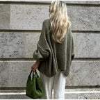 Women's oversized cozy pullover sweater made from soft knit fabric, featuring long sleeves and a relaxed fit for comfort.