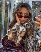 Women's oversized jacket in soft faux fur, featuring a stylish animal pattern and a relaxed fit for comfort.