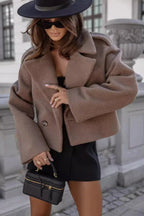 Women's oversized cropped jacket in soft cotton with a wide collar and relaxed fit, perfect for layering in casual outfits.