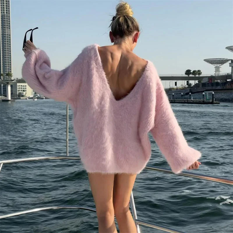 Lightweight women's oversized fluffy sweater with off-shoulder design, made from soft, cozy fabric for comfortable wear.