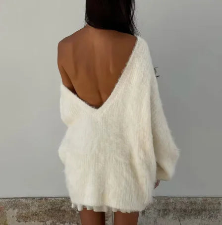 Women's oversized fluffy sweater featuring an off-shoulder design, crafted from soft, cozy material for comfort and style.