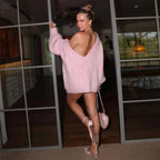 Women's oversized fluffy sweater in soft, off-shoulder design, featuring cozy fabric and relaxed fit for comfort.