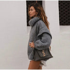 Women's oversized knit sweater dress with turtleneck, made of soft cotton blend, featuring a relaxed fit and ribbed…