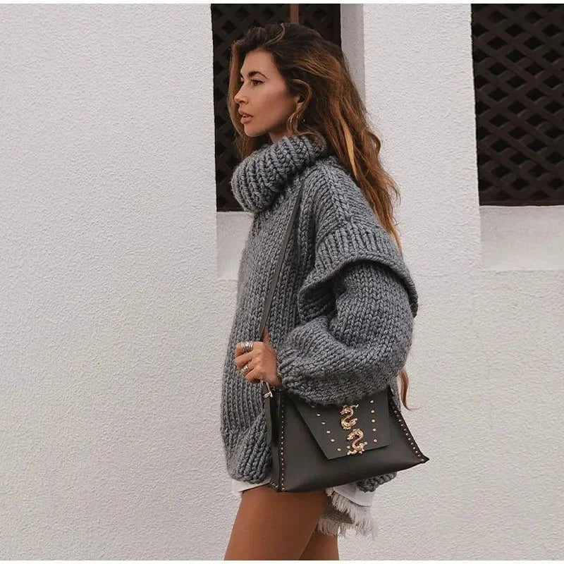 Women's oversized knit sweater dress with turtleneck, made of soft cotton blend, featuring a relaxed fit and ribbed…