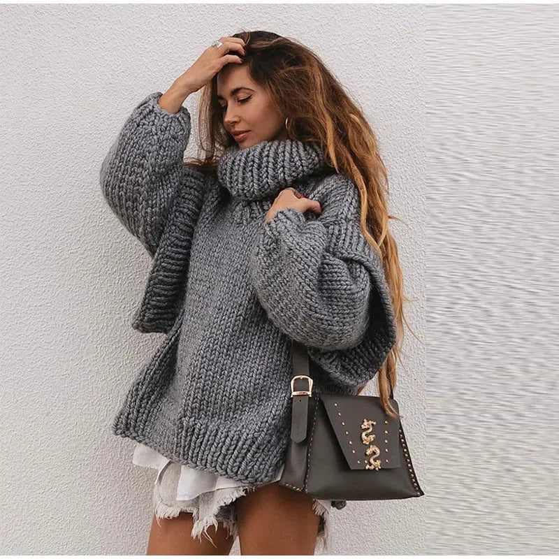 Women’s oversized knit sweater dress with turtleneck, made from soft acrylic blend, featuring a relaxed fit and cozy texture.