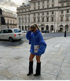 Women's oversized knit sweater dress with turtleneck, crafted from soft, warm fabric featuring a relaxed fit for comfort.