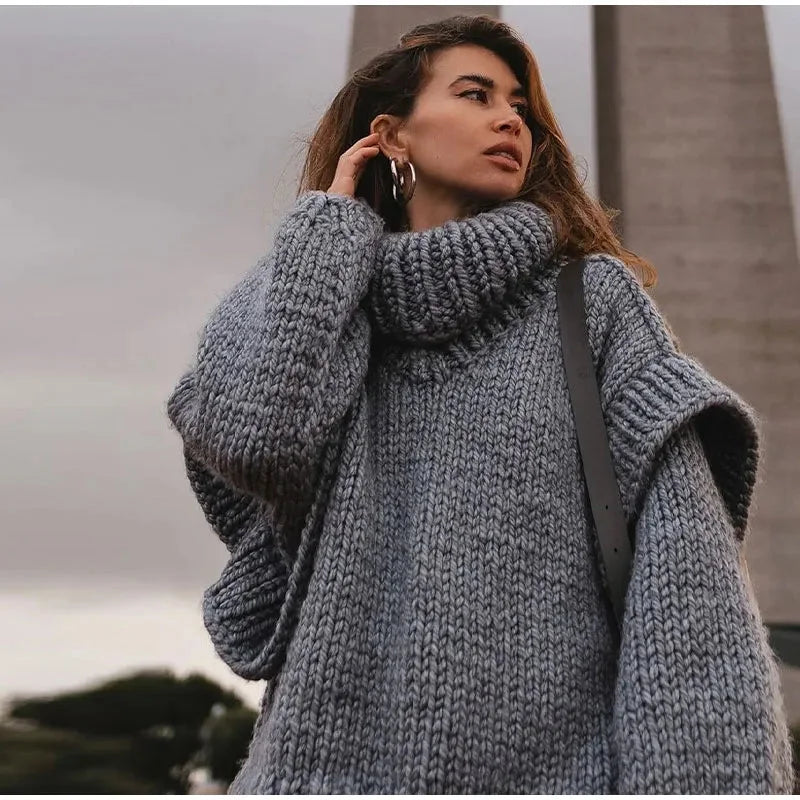 "Women's oversized turtleneck sweater dress in soft knit, featuring long sleeves and a relaxed fit for comfort and style."