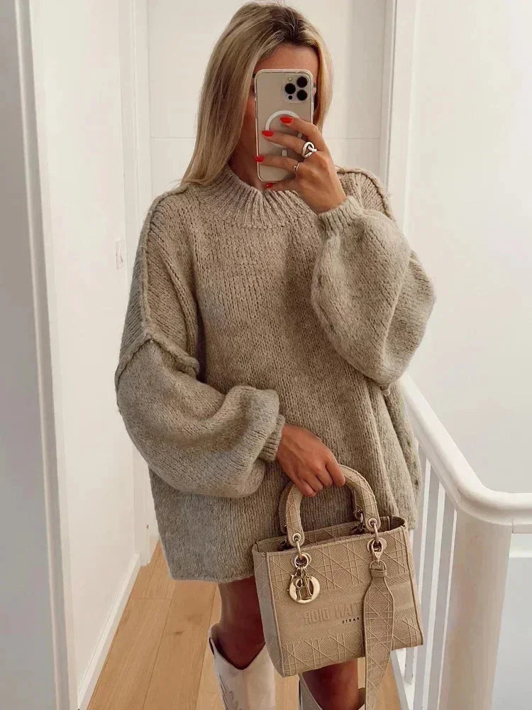 Women's oversized knit sweater featuring cozy balloon sleeves and soft, breathable fabric for comfortable layering.