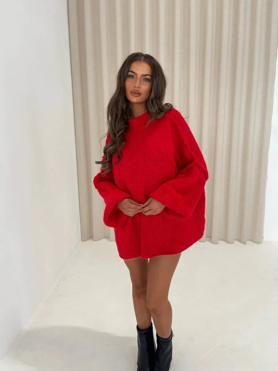 Women's oversized pullover sweater with a cozy high neckline, crafted from soft knit fabric for comfort and warmth.