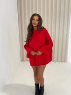 Women's oversized pullover sweater with a cozy high neckline, crafted from soft knit fabric for comfort and warmth.