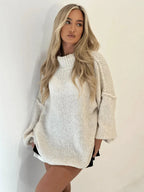 Cozy women's oversized pullover sweater featuring a high neckline, soft fabric, and a relaxed fit for comfortable layering.
