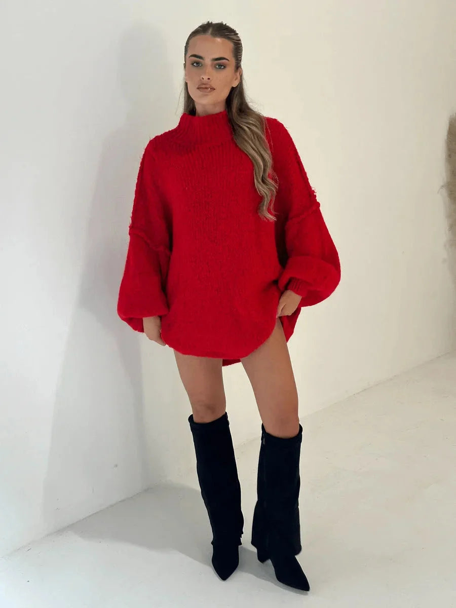 Women's oversized pullover sweater with a cozy high neckline, crafted from soft knit fabric for comfort and warmth.