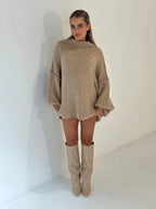 Women's oversized pullover sweater in soft knit with a cozy high neckline and relaxed fit for everyday comfort.