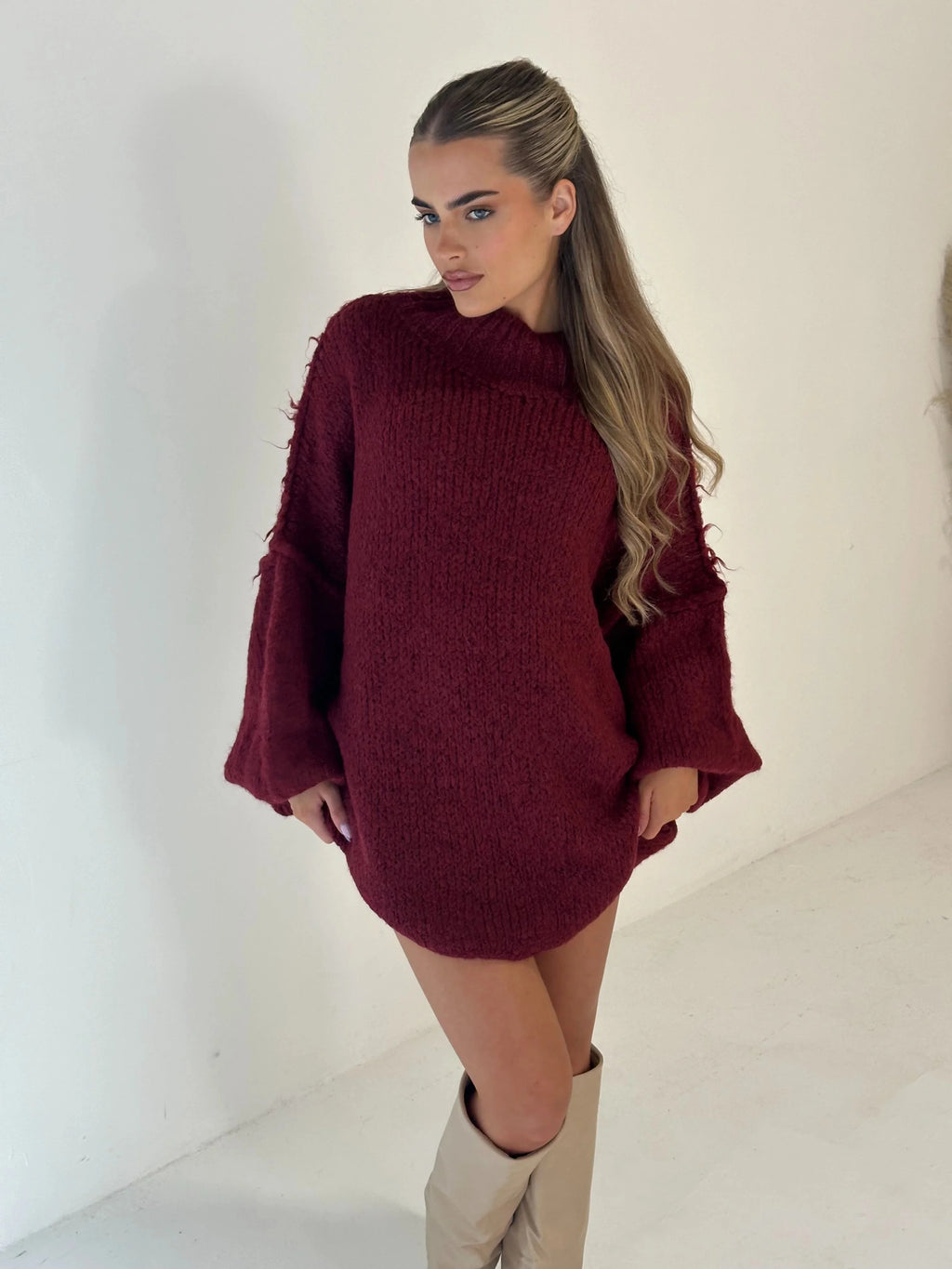 Cozy oversized women's pullover sweater featuring a high neckline, soft knit material, and relaxed fit for casual comfort.