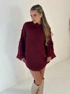 Cozy oversized women's pullover sweater featuring a high neckline, soft knit material, and relaxed fit for casual comfort.