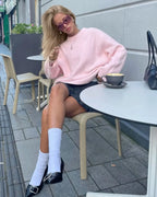 Soft pink oversized sweater for women featuring long sleeves and cozy, breathable fabric for comfortable, relaxed wear.