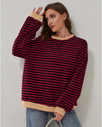 Women's oversized striped long sleeve sweatshirt in soft cotton blend, featuring a relaxed fit and colorful horizontal…