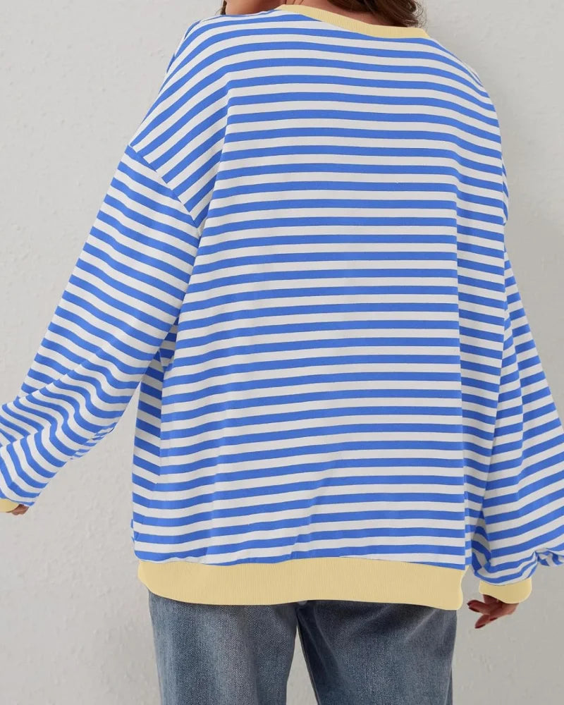 Women's oversized striped long sleeve sweatshirt, made of soft cotton blend, featuring relaxed fit and classic round neck…