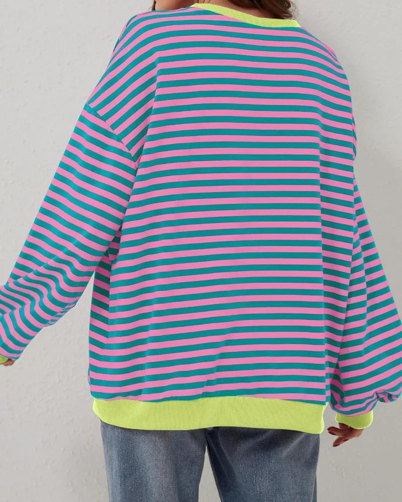 Women's oversized striped long sleeve sweatshirt made from soft cotton blend, featuring a relaxed fit and classic crew…