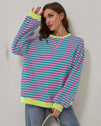 Women's oversized striped long sleeve sweatshirt made of soft cotton blend with a relaxed fit and wide cuffs.