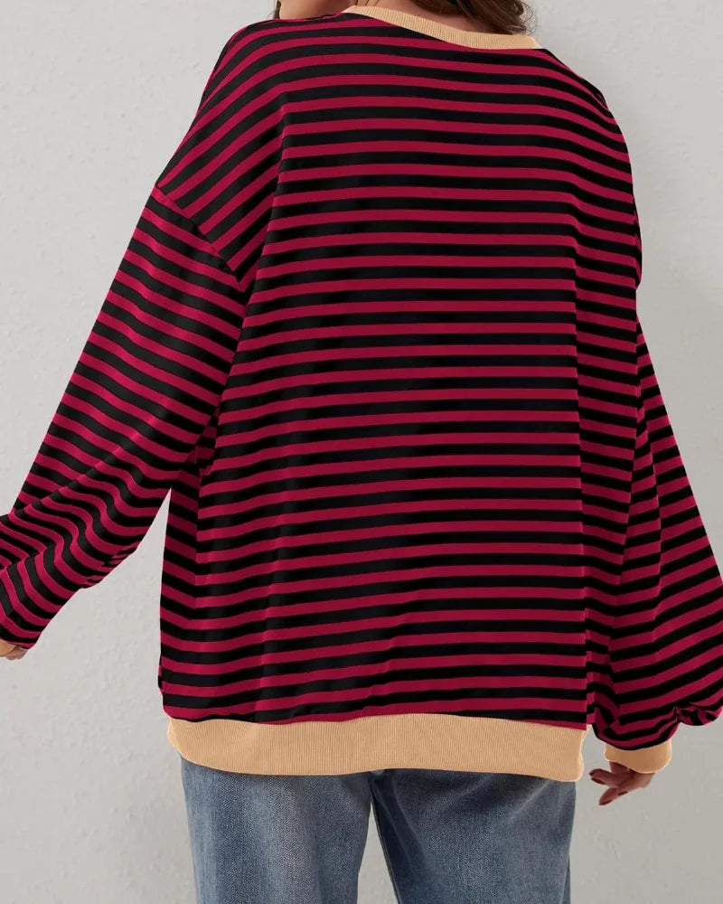 Women's oversized striped long sleeve sweatshirt made of soft cotton blend, featuring a relaxed fit and wide cuffs.