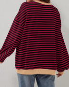 Women's oversized striped long sleeve sweatshirt made of soft cotton blend, featuring a relaxed fit and wide cuffs.