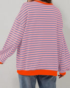 Women’s oversized striped long sleeve sweatshirt made from soft cotton blend, featuring a relaxed fit and bold horizontal…