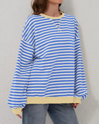 Women's oversized striped long sleeve sweatshirt made from soft cotton blend with a relaxed fit and wide cuffs.