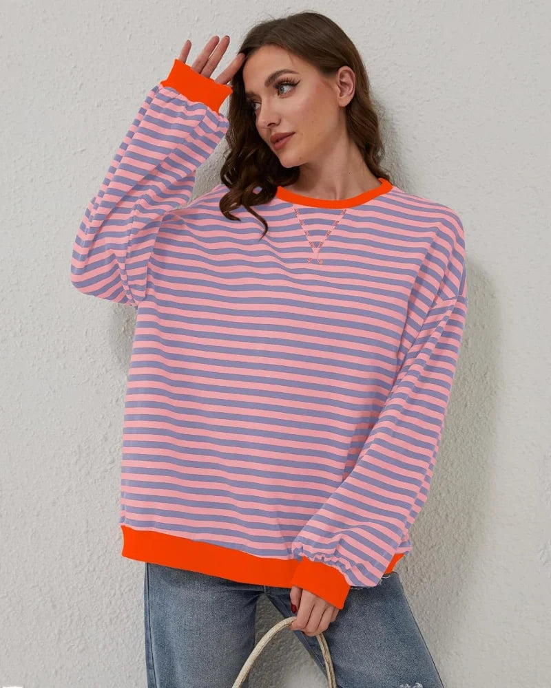 Women’s oversized striped long sleeve sweatshirt made from soft cotton blend, featuring a relaxed fit and crew neckline.