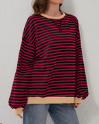 Women's oversized striped long sleeve sweatshirt in soft cotton blend, featuring a relaxed fit and classic crew neckline.