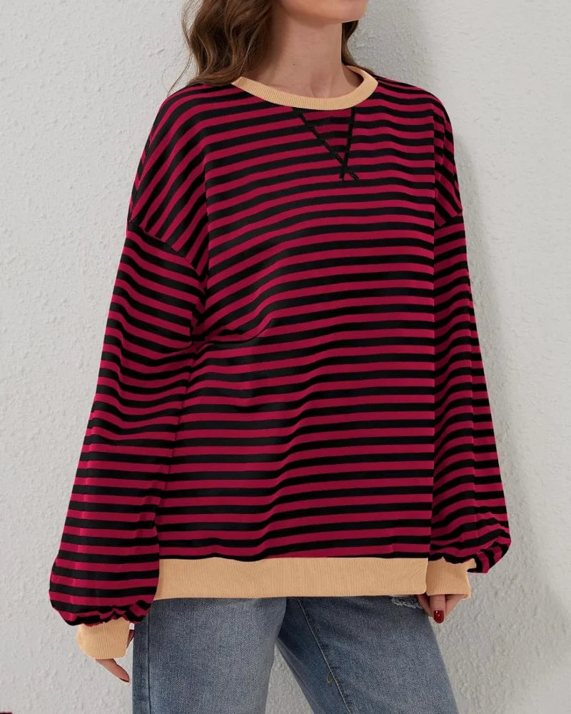 Women's oversized striped long sleeve sweatshirt in soft cotton blend, featuring a relaxed fit and classic crew neckline.