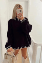 Cozy women's oversized sweater featuring striped details, made of soft cotton blend for comfortable everyday wear.