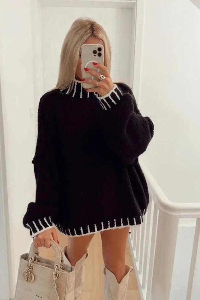 Cozy women's oversized sweater featuring striped details, made of soft cotton blend for comfortable everyday wear.