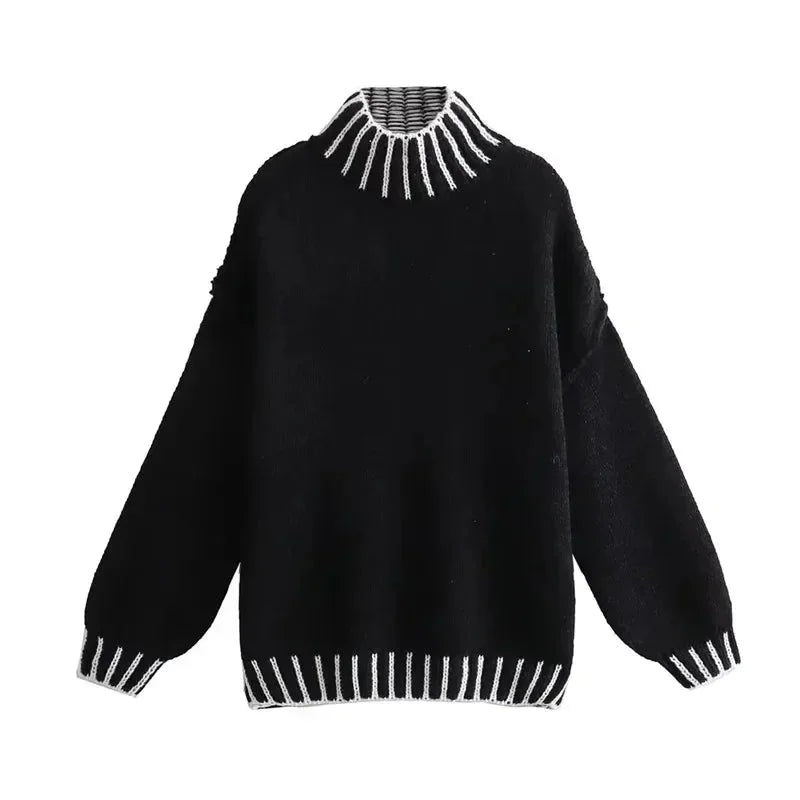 Women's oversized sweater featuring soft knit fabric and striped details on sleeves for a comfortable and casual look.