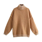 Women's oversized sweater featuring soft fabric and stylish striped details for a relaxed, comfortable fit.