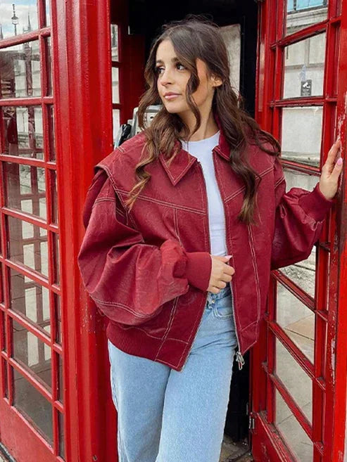 Women's oversized bomber jacket in soft velvet, featuring a zip front and relaxed fit for comfortable layering.